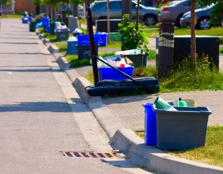 PPE and tools laid out before starting an insured waste removal project